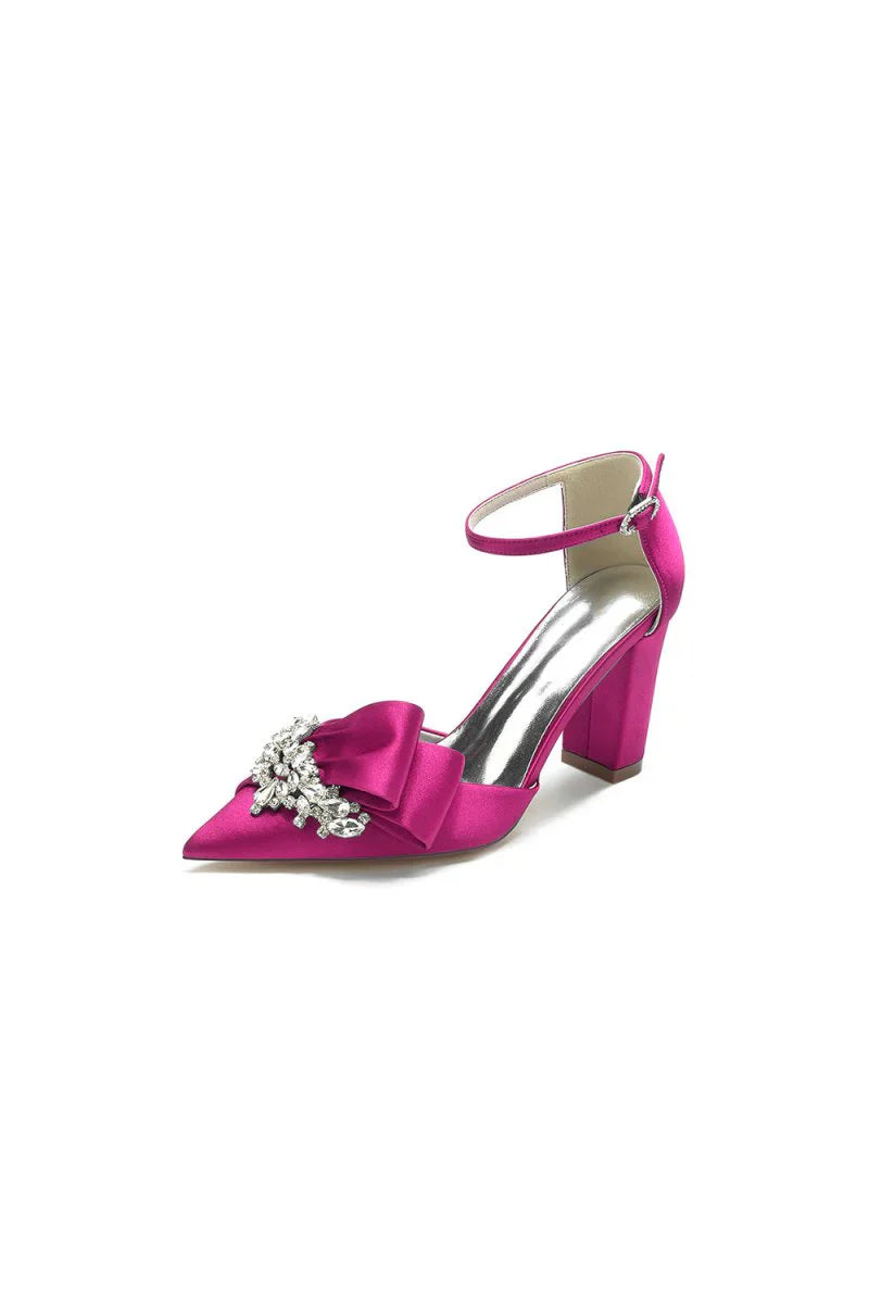 White Satin Heels Featuring a Large Decorative Bow and Metallic Heel